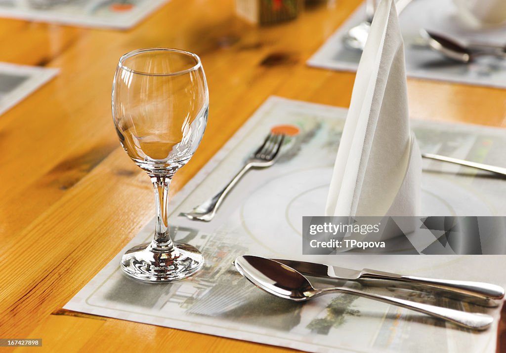 Glasse and plate on table in restaurant