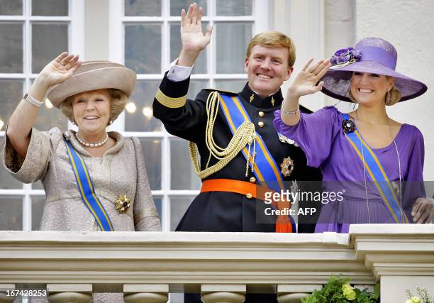 Dutch Queen Beatrix, Crownprince Willem Alexander and Princess Maxima wave to the crowd from the balcony of palace Noordeinde in The Hague, on...