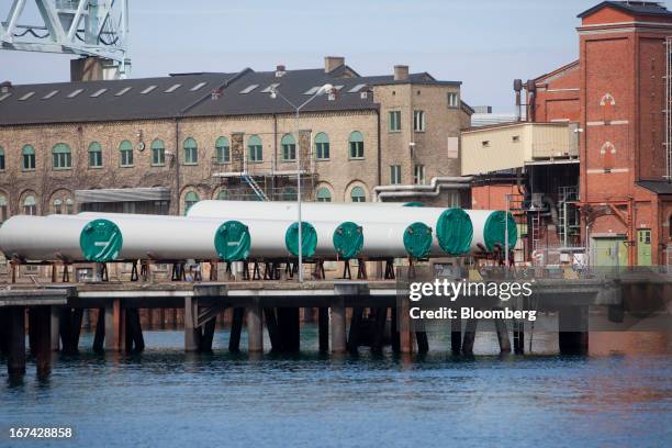 Completed windtower sections stand on the quay before shipment at the Enercon Windtower Production AB plant in Malmoe, Sweden, on Thursday, April 25,...