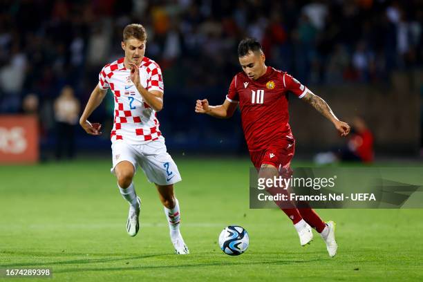 Lucas Zelarayan of Armenia battles for possession with Josip Stanisic of Croatia during the UEFA EURO 2024 European qualifier match between Armenia...