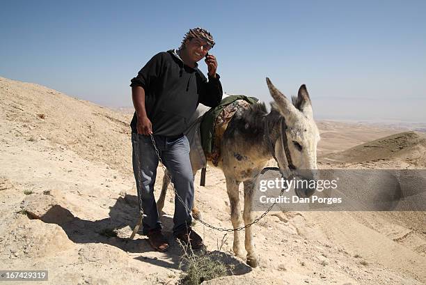 digital nomad and his ass - middle eastern male on phone isolated stock pictures, royalty-free photos & images