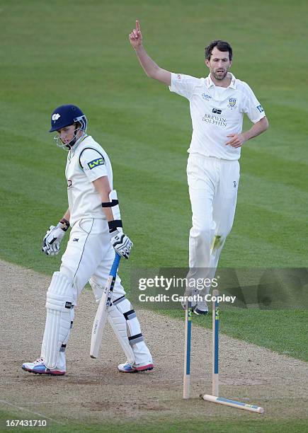 Graham Onions of Durham celebrates bowling Joe Root of Yorkshire during day two of the LV County Championship division one match between Durham and...