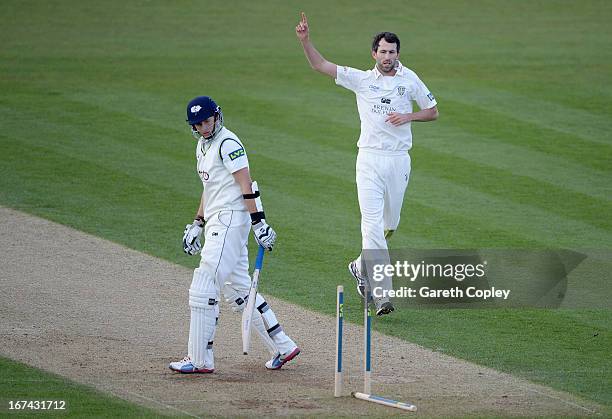 Graham Onions of Durham celebrates bowling Joe Root of Yorkshire during day two of the LV County Championship division one match between Durham and...