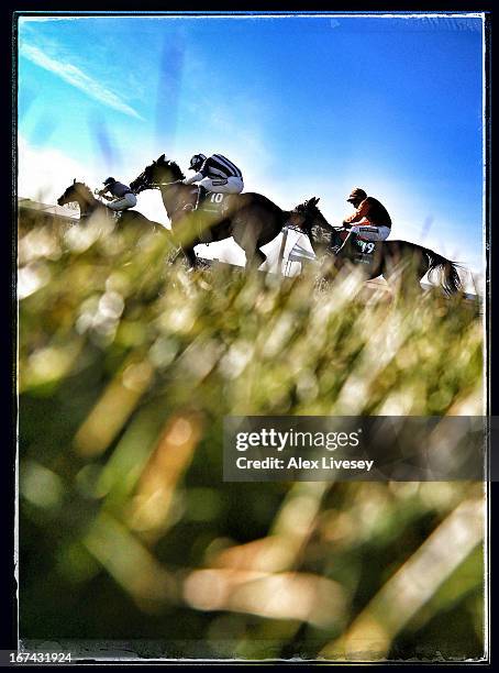 Ryan Mania riding Auroras Encore leads Teaforthree ridden by Nick Schofield on their way to victory in the John Smiths Grand National at Aintree...