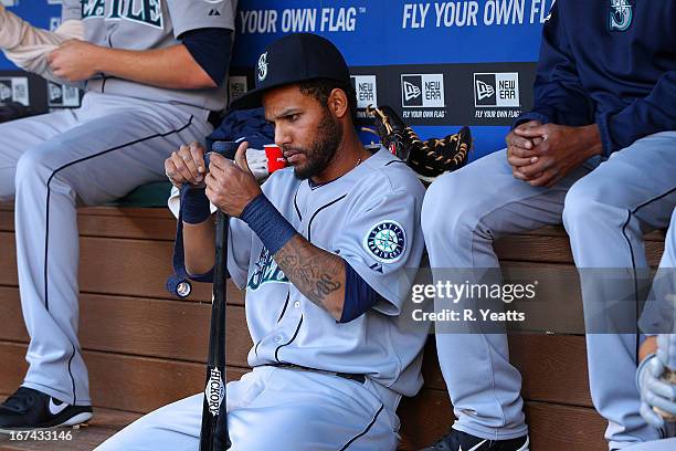 Robert Andino of the Seattle Mariners prepares his bat prior to the start of the game against the Texas Rangers at Rangers Ballpark on April 20, 2013...