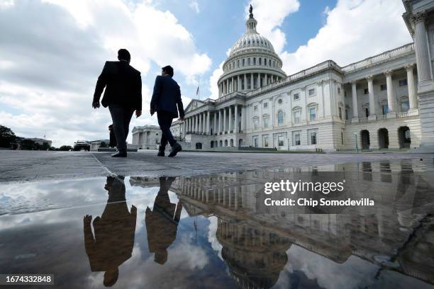 Visitors walk past the U.S. Capitol on September 11, 2023 in Washington, DC. The House of Representatives is scheduled to return Tuesday following an...