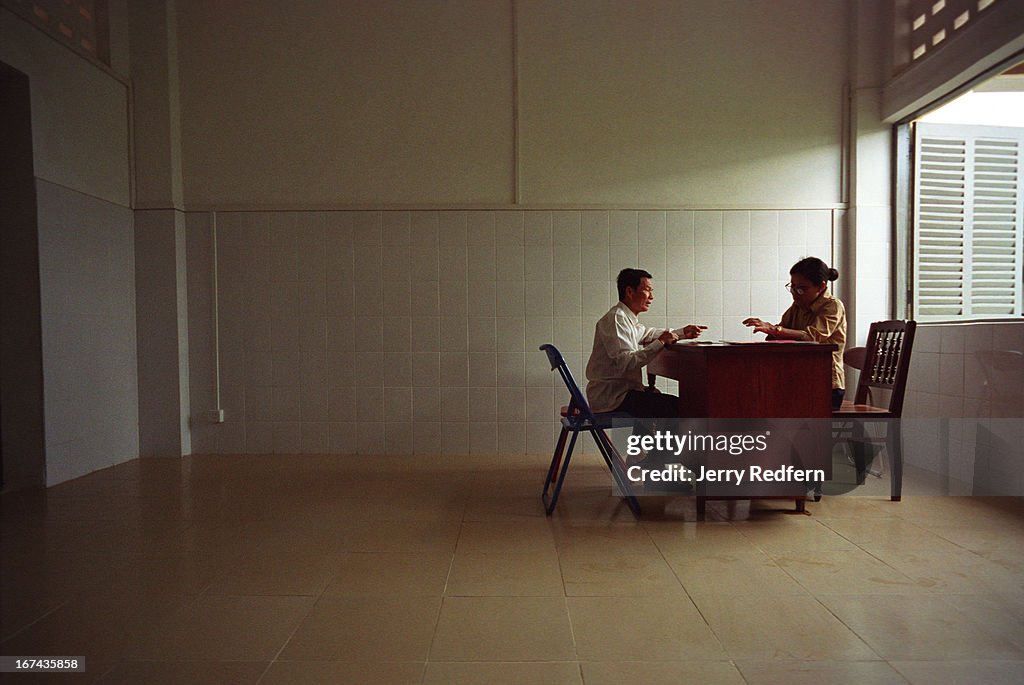 Po Kith Ly, left, talks with his psychiatrist, Ang Sody, in...