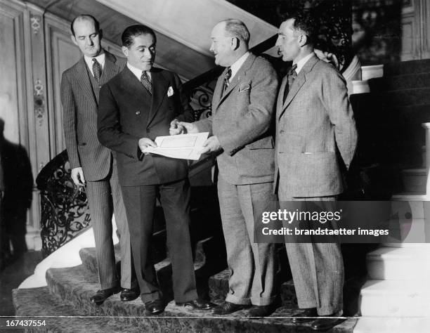 Award Ceremony of the Flyers. From left to right: Charles Murphy; Major Dieudonne Coste; William Easterwood and Maurice Bellon. Presentation of $...