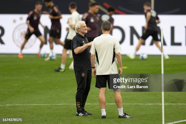 Sports director and interim coach Rudi Voeller of Germany talks to Hannes Wolf during a training session on September 11, 2023 in Dortmund, Germany,...