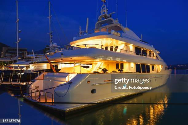 yacht in the marina at night - luxury yacht stock pictures, royalty-free photos & images