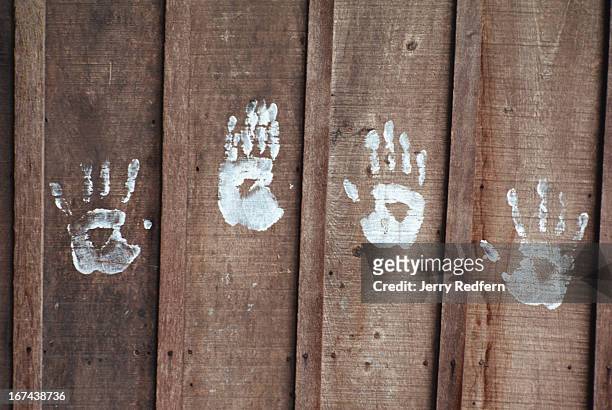 Some left-over paint was used to make handprints on the wall of the Cambodian Light Children Association. Pat Noun started the Cambodian Light...