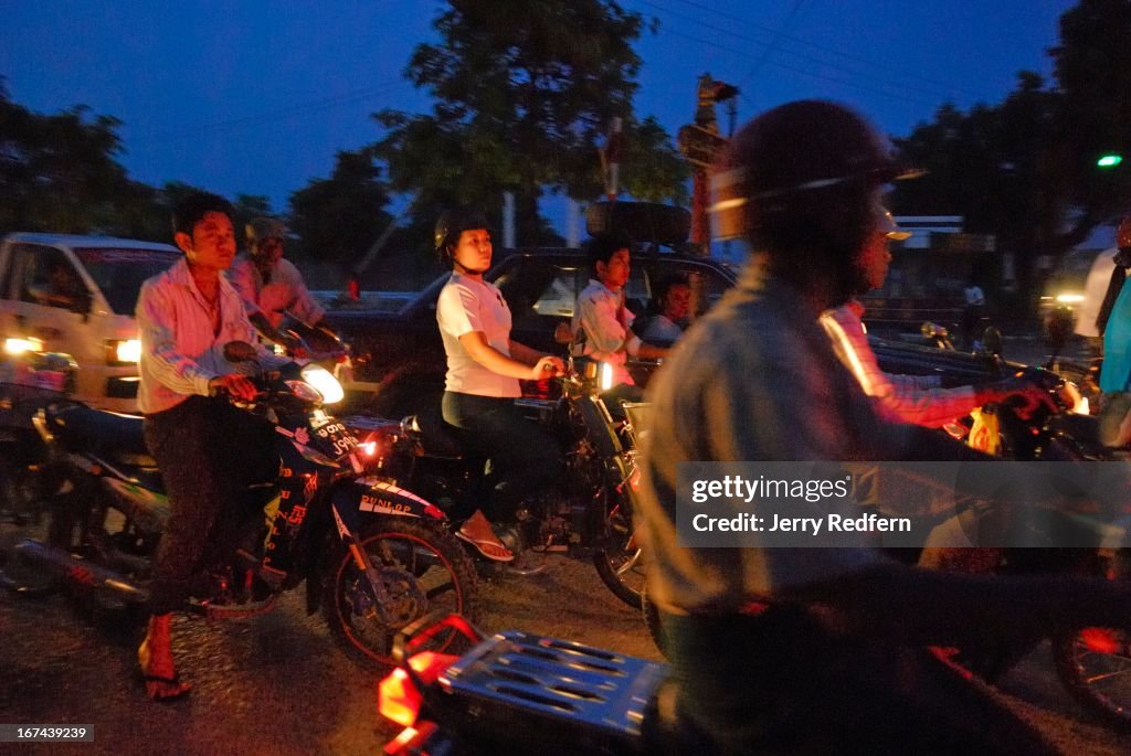 View of evening rush-hour traffic in downtown Mandalay,...