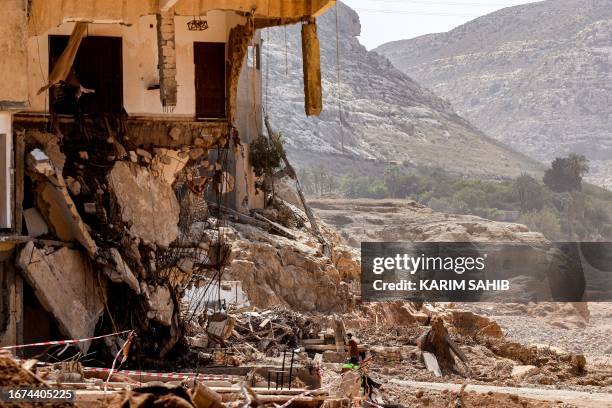 This picture taken on September 18, 2023 shows a view of a destroyed building in Libya's eastern city of Derna following deadly flash floods. A week...