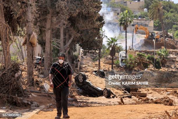 This picture taken on September 18, 2023 shows a view of a destroyed building in Libya's eastern city of Derna following deadly flash floods. A week...