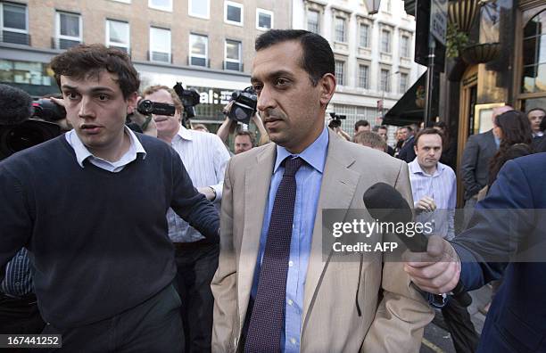 Horse trainer of the leading Godolphin stable Mahmood Al Zarooni is followed by reporters as he leaves a disciplinary hearing at the British...