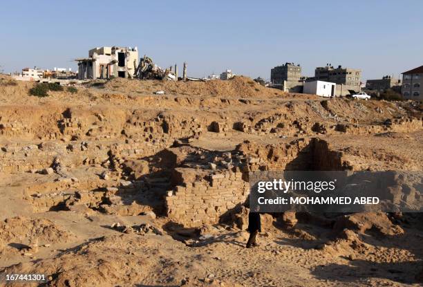 Palestinian worker inspects the ancient archaeological site of Anthedon Harbour, also know as "al-Blakhiyah", which is located next to a training...