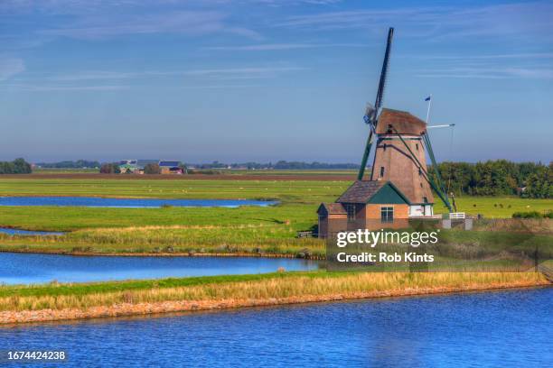 windmill het noorden in polder oosterend on texel island - friesland stock pictures, royalty-free photos & images