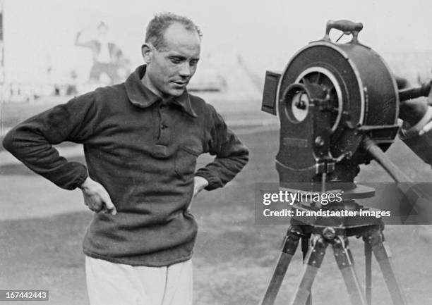 Finnish athlete and from 1920 to 1928 winner of nine gold medals at the Olympics Paavo Nurmi in an interview with a sound film camera. About 1928....