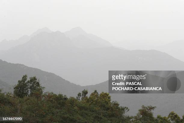 Photo shows smog from polllution over mountains in the Taravo valley, near Cognocoli-Monticchi, on the French Mediterranean island of Corsica, on...
