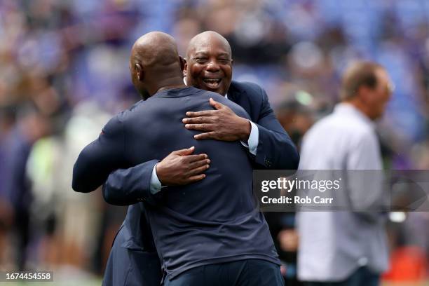 Former general manager Ozzie Newsome of the Baltimore Ravens hugs head coach DeMeco Ryans of the Houston Texans before the start of their game at M&T...