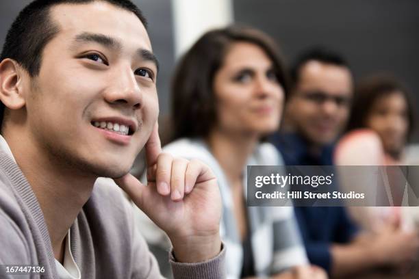 students sitting in classroom - chinese man looking up bildbanksfoton och bilder