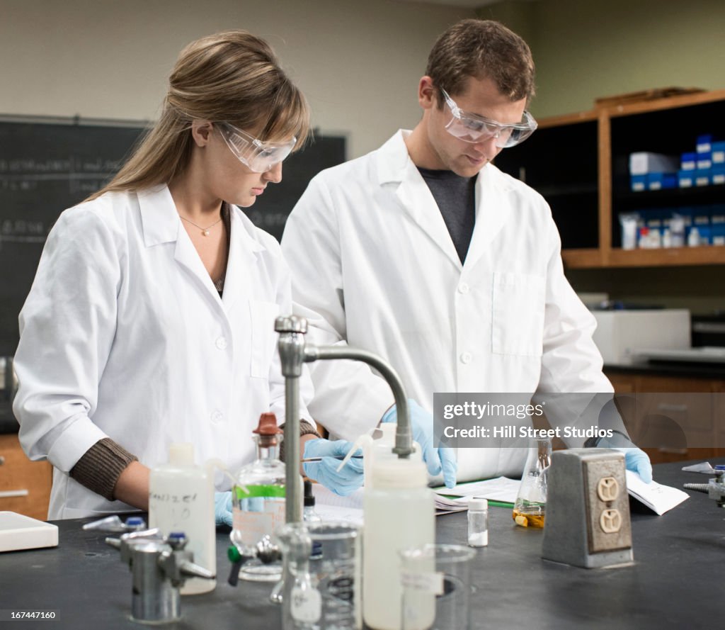 Caucasian students working in lab classroom