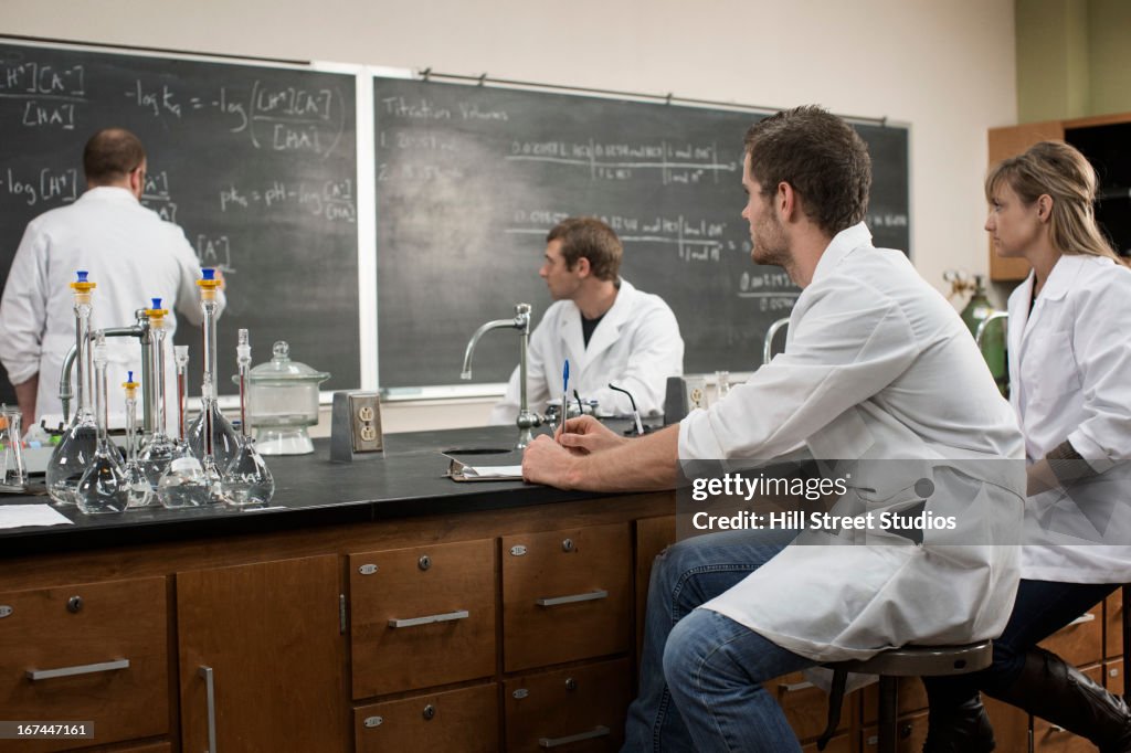 Caucasian students working in lab classroom