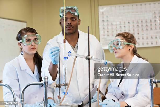 students working in lab classroom - titration stock pictures, royalty-free photos & images