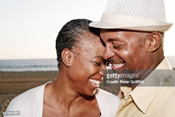Black couple hugging outdoors