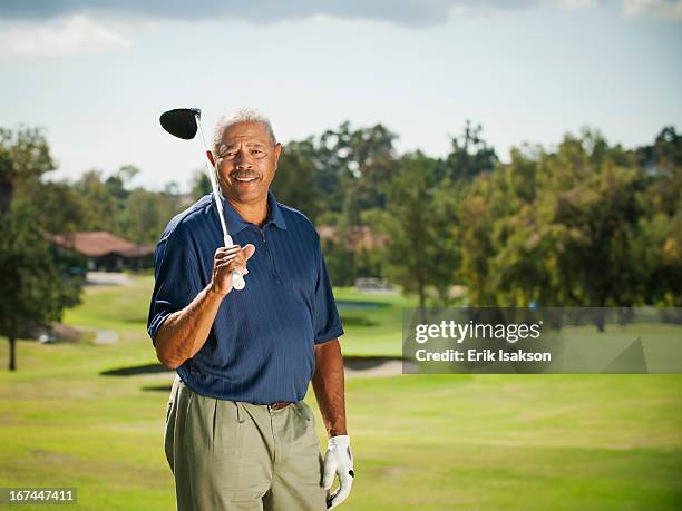 black man playing golf - senior men golf stock pictures, royalty-free photos & images