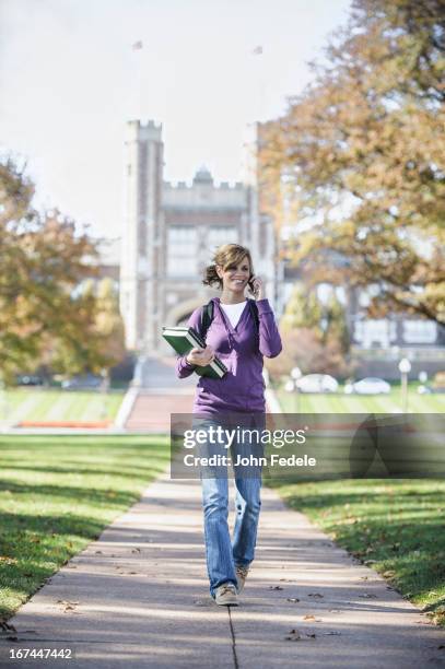 caucasian student on cell phone on campus - saint louis university bildbanksfoton och bilder