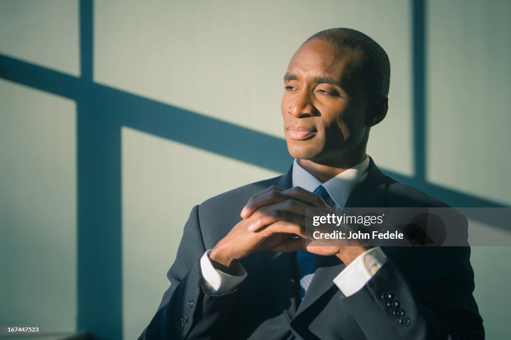 Black businessman sitting at desk