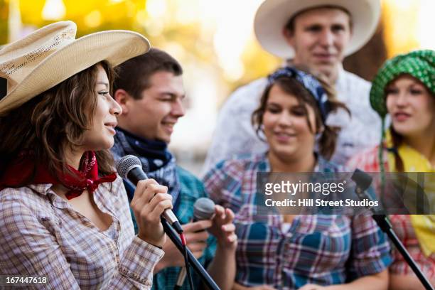 students singing together - country and western music stock-fotos und bilder