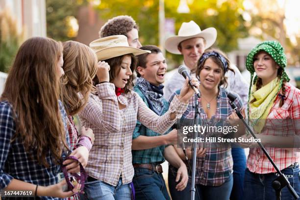 students singing together - country and western music stock pictures, royalty-free photos & images