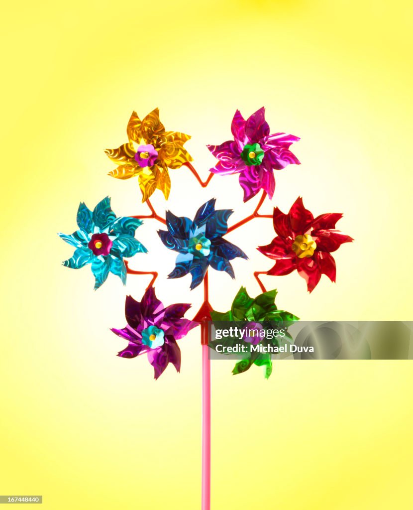 Studio shot pinwheel toy on yellow background