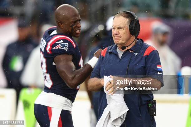 Matthew Slater of the New England Patriots talks with Head coach Bill Belichick prior to an NFL football game against the Philadelphia Eagles at...