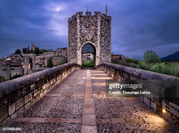 sunset shot besalú roman bridge - besalu stock pictures, royalty-free photos & images