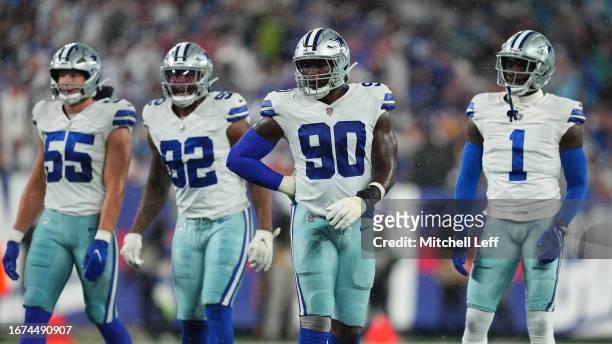 Leighton Vander Esch, Dorance Armstrong, DeMarcus Lawrence, and Jayron Kearse of the Dallas Cowboys look on against the New York Giants at MetLife...