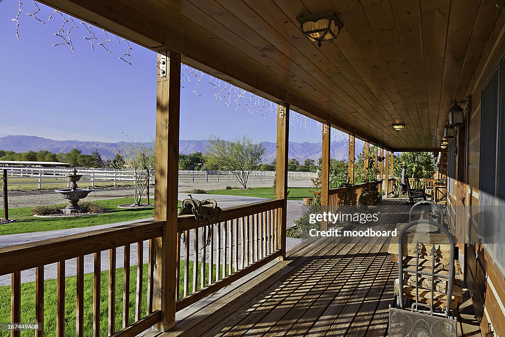 Ranch porch overlooking horse stables