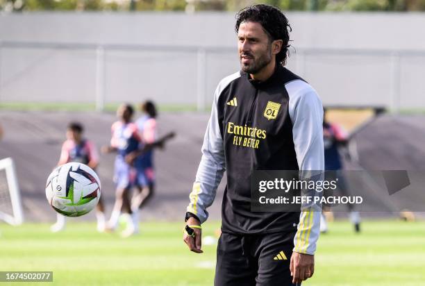 Lyon's Italian new head coach Fabio Grosso leads his first training session with the Olympique Lyonnais' players in Decines-Charpieu, eastern France,...