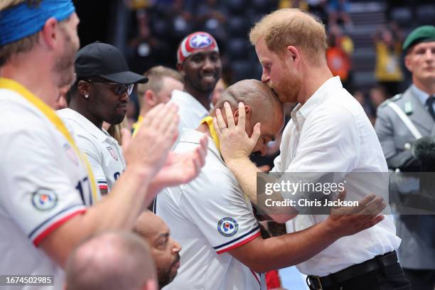 Prince Harry, Duke of Sussex congratulates members of Team USA after they won the Gold Medal at the Wheelchair Rugby finals during day two of the...