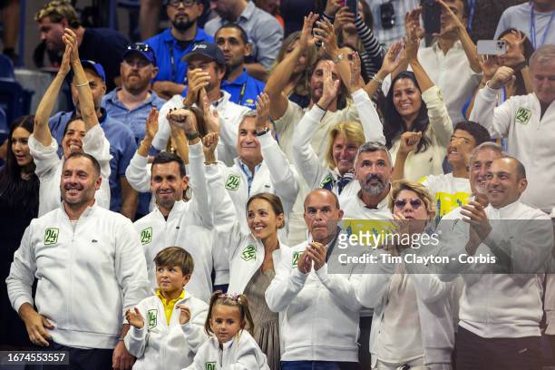 September 10: The team of Novak Djokovic of Serbia, including wife Jelena Djokovic and children Stefan and Tara, wearing tracksuit tops representing...