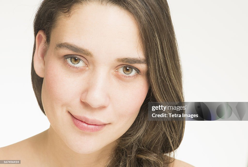 Portrait of young woman, studio shot