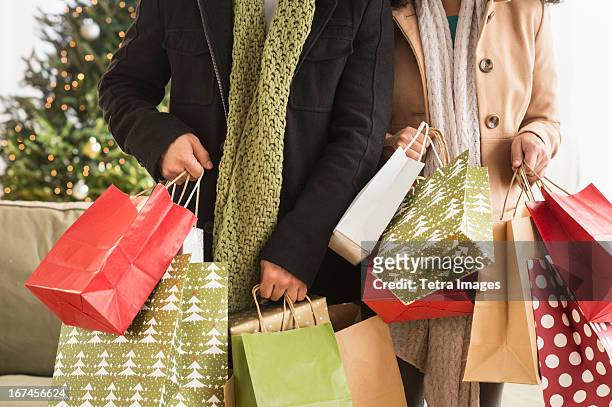 usa, new jersey, jersey city, couple with christmas shopping - commercial activity stock pictures, royalty-free photos & images