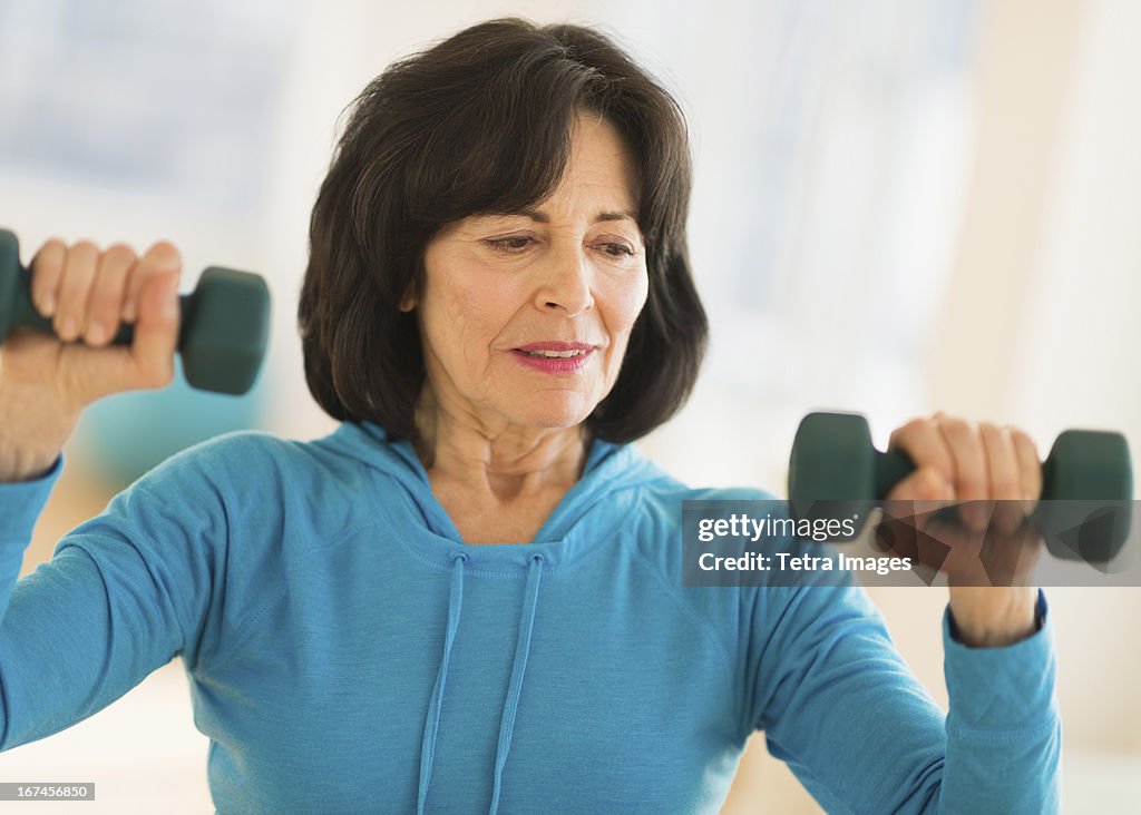 USA, New Jersey, Jersey City, Portrait of senior woman exercising