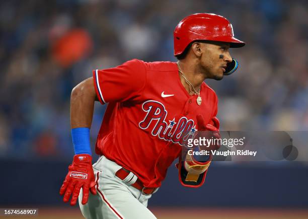 Johan Rojas of the Philadelphia Phillies runs to first base against the Toronto Blue Jays at Rogers Centre on August 16, 2023 in Toronto, Ontario,...