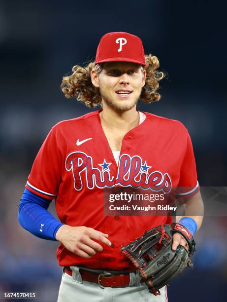 Alec Bohm of the Philadelphia Phillies runs to the dugout against the Toronto Blue Jays at Rogers Centre on August 16, 2023 in Toronto, Ontario,...