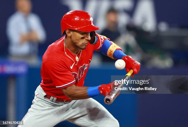 Johan Rojas of the Philadelphia Phillies bunts the ball against the Toronto Blue Jays at Rogers Centre on August 16, 2023 in Toronto, Ontario, Canada.