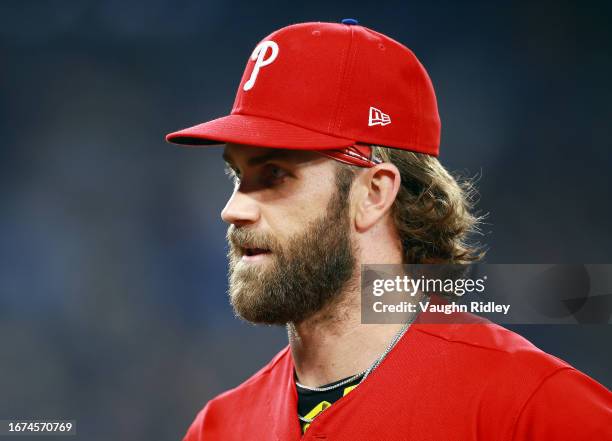 Bryce Harper of the Philadelphia Phillies runs to the dugout against the Toronto Blue Jays at Rogers Centre on August 16, 2023 in Toronto, Ontario,...