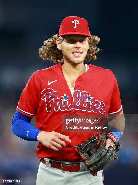 Alec Bohm of the Philadelphia Phillies runs to the dugout against the Toronto Blue Jays at Rogers Centre on August 16, 2023 in Toronto, Ontario,...